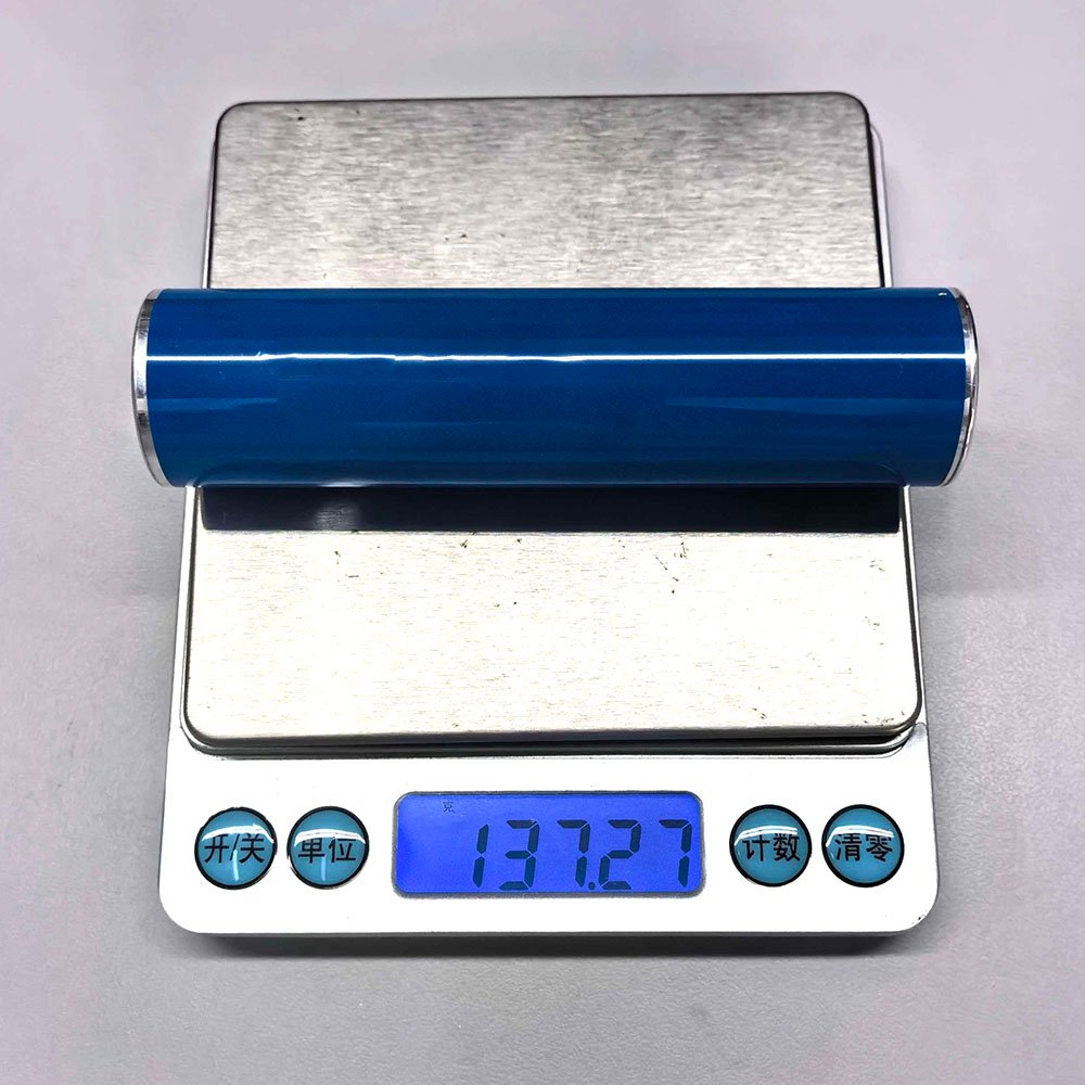 EVE INR26105E cylindrical lithium-ion cell weight check on digital scale